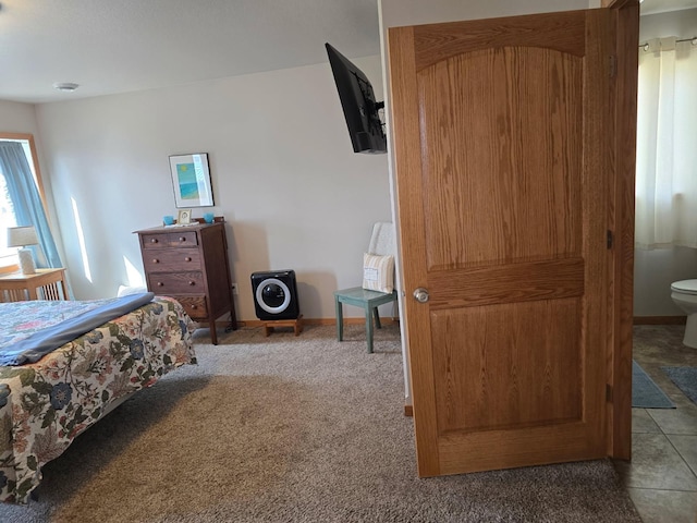 bedroom featuring baseboards and carpet floors