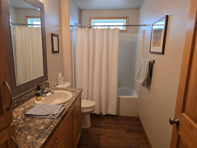 full bathroom with shower / bath combination with curtain, toilet, wood finished floors, and vanity