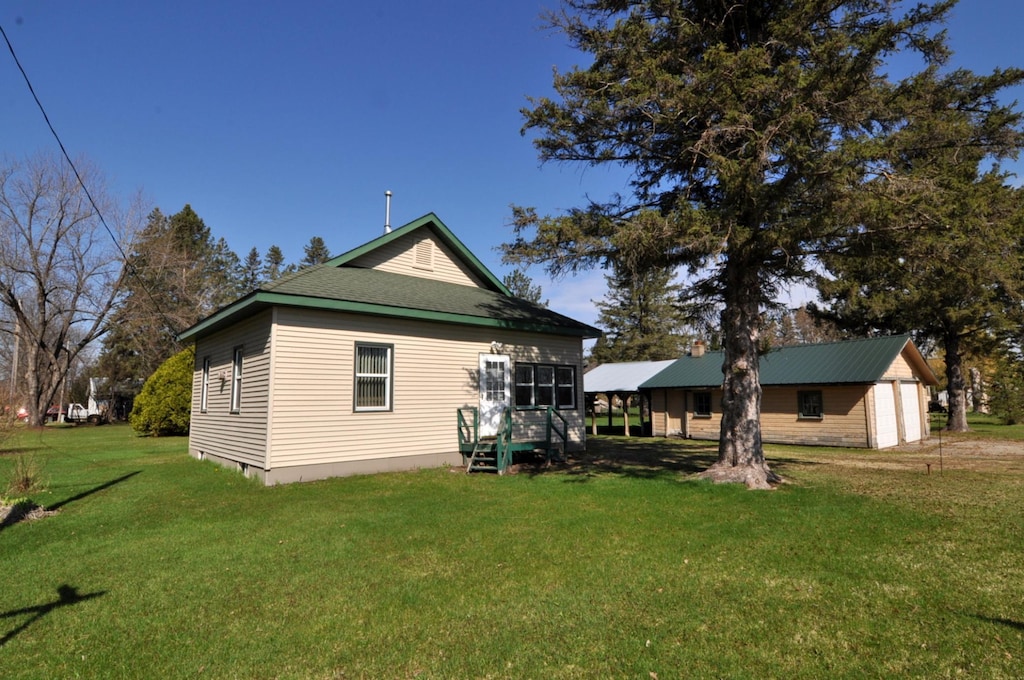 back of house with a yard