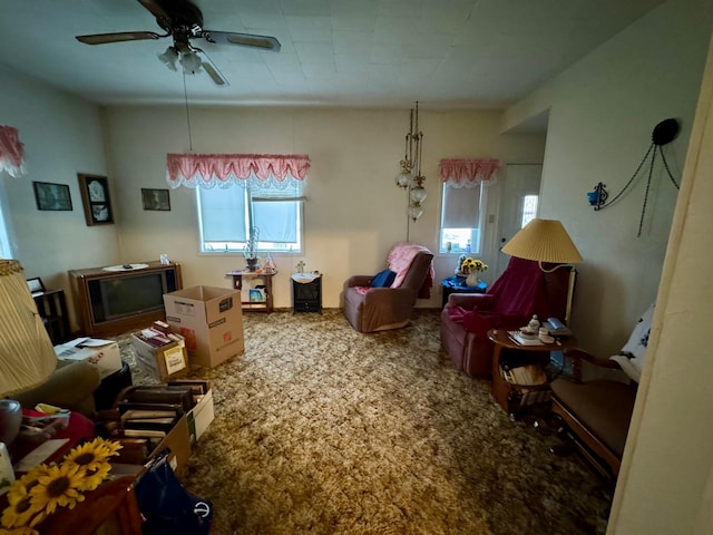 carpeted living room featuring ceiling fan