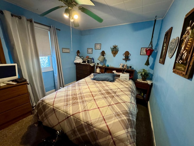 carpeted bedroom with a ceiling fan