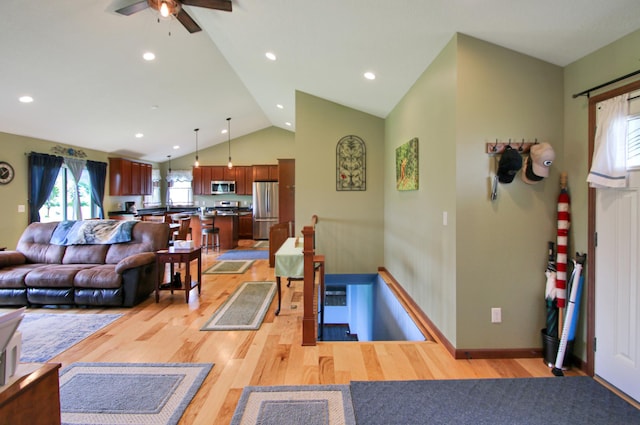 1052 Hidden Ln, New Richmond, WI 54017 - living room with ceiling fan, vaulted ceiling, recessed lighting, and light wood-style flooring
