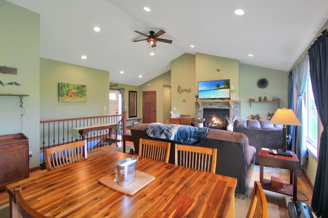 1052 Hidden Ln, New Richmond, WI 54017 - dining area with high vaulted ceiling, a ceiling fan, recessed lighting, and a stone fireplace