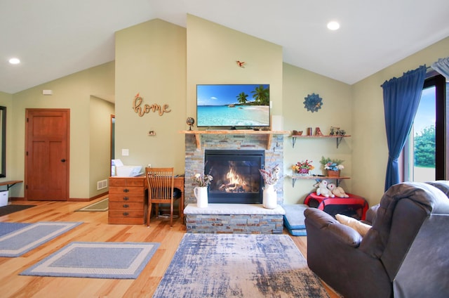 1052 Hidden Ln, New Richmond, WI 54017 - living area featuring visible vents, wood finished floors, lofted ceiling, a fireplace, and recessed lighting