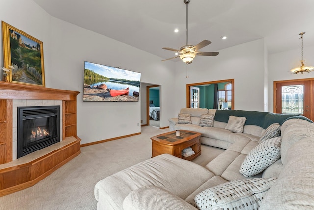 carpeted living room with baseboards, recessed lighting, ceiling fan, and a tile fireplace