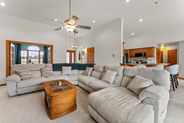 living room featuring a ceiling fan, baseboards, and recessed lighting