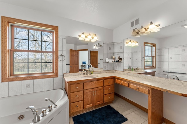 full bathroom featuring visible vents, plenty of natural light, tile patterned floors, and a jetted tub