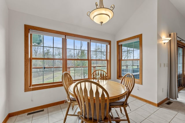 dining area with visible vents, baseboards, plenty of natural light, and vaulted ceiling