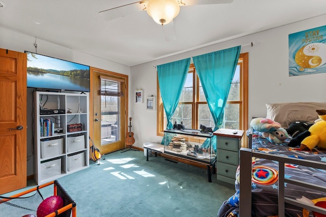 interior space featuring carpet floors and ceiling fan