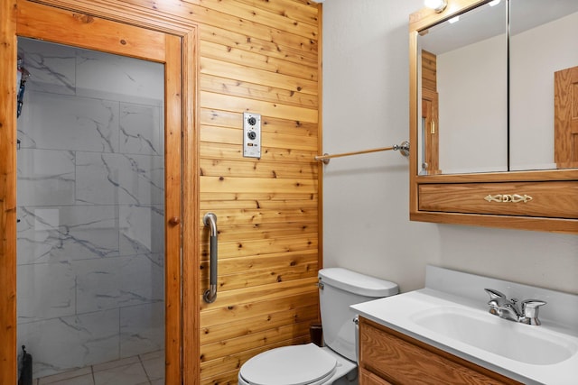bathroom with vanity, wood walls, a shower, and toilet