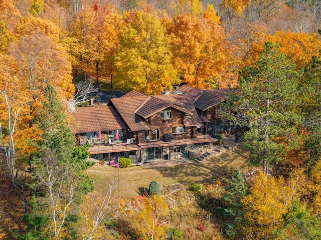 drone / aerial view featuring a forest view