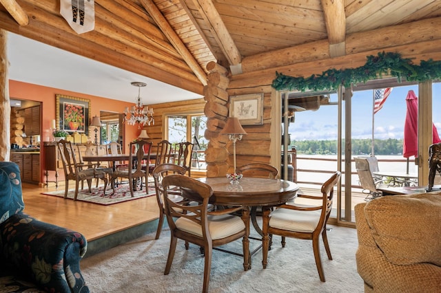 dining room with an inviting chandelier, beamed ceiling, rustic walls, and light colored carpet