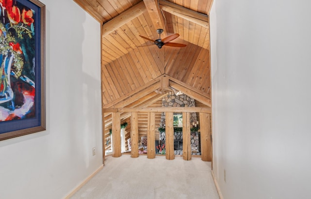 details with beamed ceiling, baseboards, ceiling fan, wood ceiling, and carpet flooring