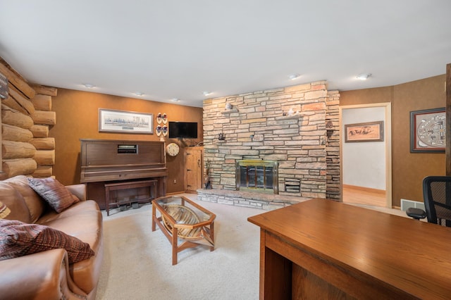 living room with carpet and a fireplace