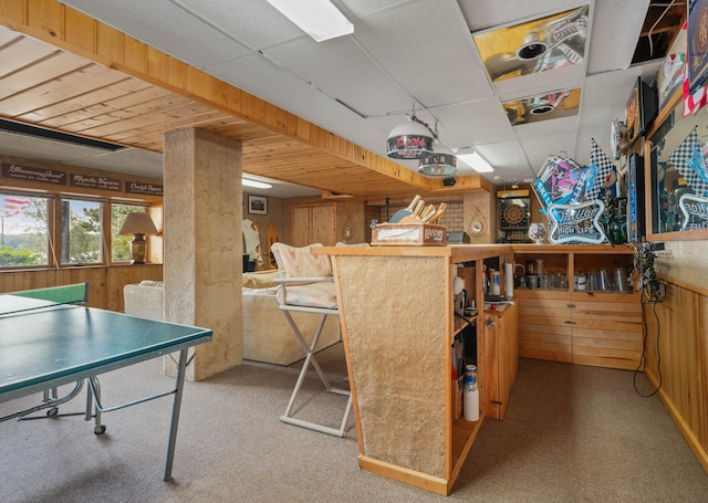 game room featuring wood walls