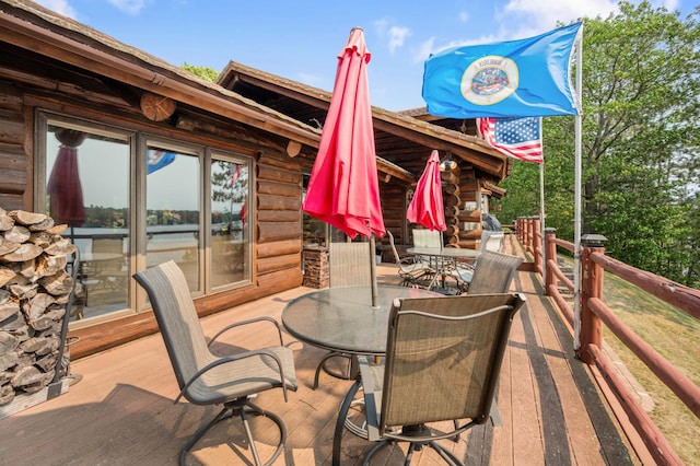 view of patio / terrace with outdoor dining area and a deck