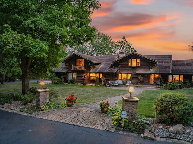 30047 Sunny Beach Rd, Grand Rapids, MN 55744 - log cabin featuring log exterior, a front lawn, stairs, and an outdoor hangout area