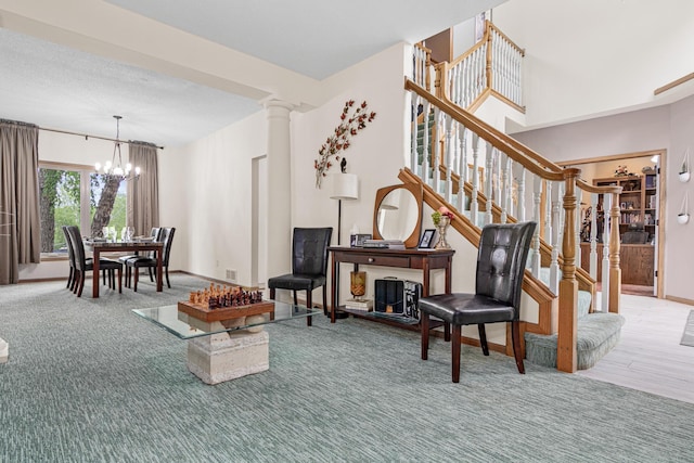 14217 Footbridge Way, Apple Valley, MN 55124 - living area featuring a chandelier, stairway, and decorative columns