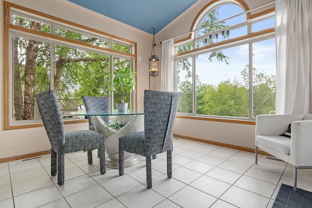 14217 Footbridge Way, Apple Valley, MN 55124 - dining area featuring light tile patterned flooring, plenty of natural light, and vaulted ceiling