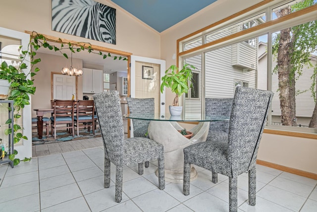 14217 Footbridge Way, Apple Valley, MN 55124 - dining area featuring a chandelier, vaulted ceiling, and light tile patterned floors