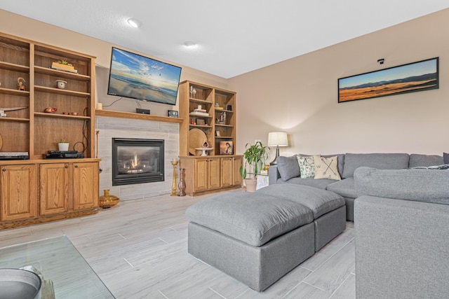 14217 Footbridge Way, Apple Valley, MN 55124 - living room featuring a tile fireplace and wood finish floors