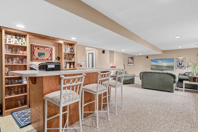 14217 Footbridge Way, Apple Valley, MN 55124 - indoor dry bar with a textured ceiling, carpet floors, and recessed lighting