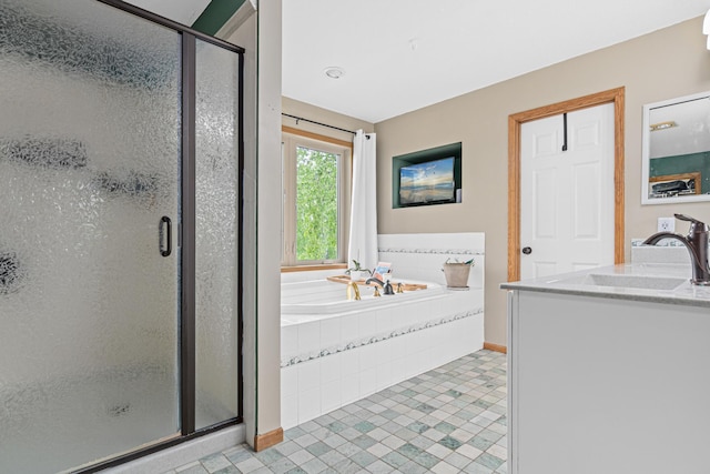 14217 Footbridge Way, Apple Valley, MN 55124 - bathroom featuring a stall shower, a garden tub, tile patterned floors, and vanity