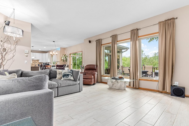 14217 Footbridge Way, Apple Valley, MN 55124 - living room with a chandelier, light wood-style floors, and recessed lighting