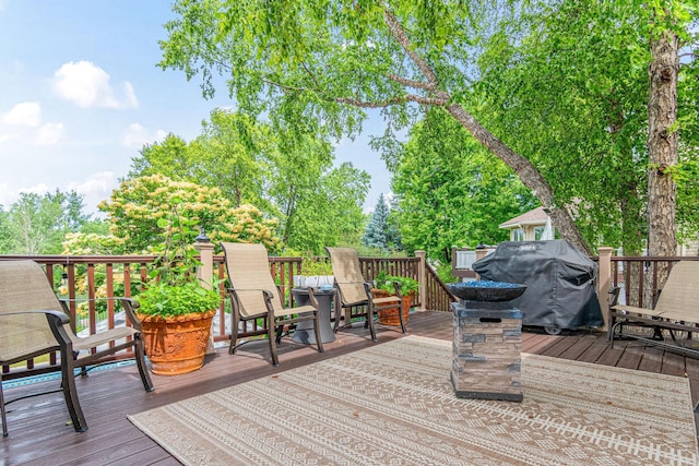 14217 Footbridge Way, Apple Valley, MN 55124 - wooden terrace featuring a grill and view of wooded area