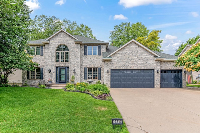14217 Footbridge Way, Apple Valley, MN 55124 - view of front of property with a garage, concrete driveway, a front yard, brick siding, and a shingled roof