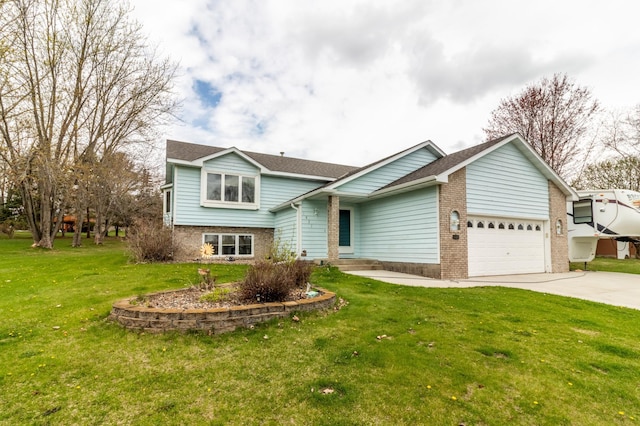 tri-level home with brick siding, a garage, a front yard, and concrete driveway