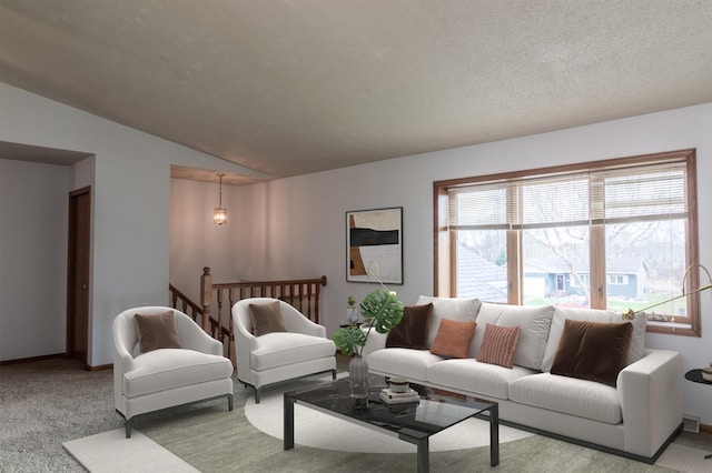living area featuring baseboards, carpet flooring, and lofted ceiling