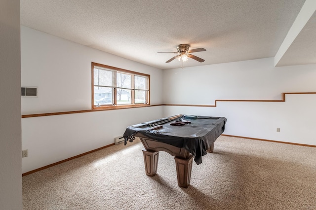 playroom with ceiling fan, carpet flooring, a textured ceiling, and visible vents