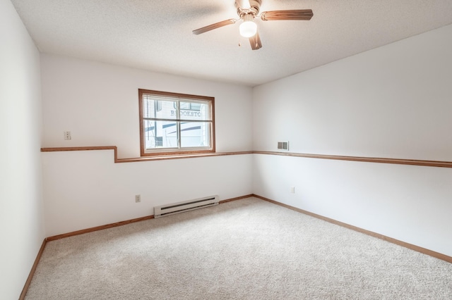 empty room featuring carpet floors, visible vents, baseboards, ceiling fan, and a baseboard radiator