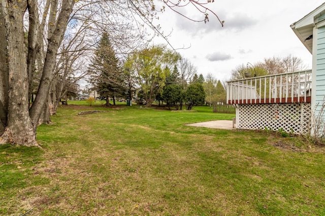 view of yard featuring a wooden deck