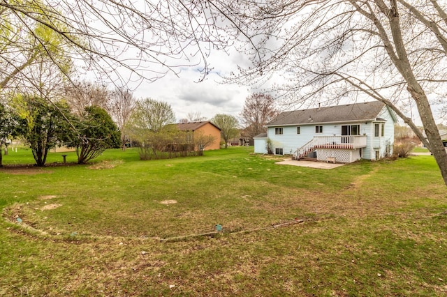 view of yard with a deck