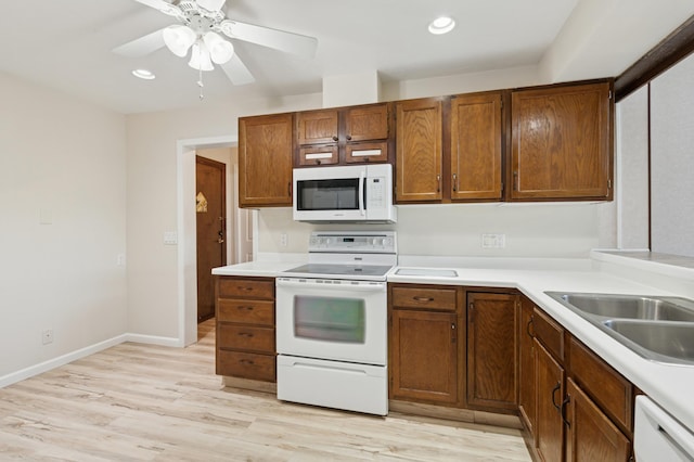 9600 Portland Ave S Unit 322, Bloomington, MN 55420 - kitchen featuring white appliances, light wood-style flooring, recessed lighting, light countertops, and ceiling fan