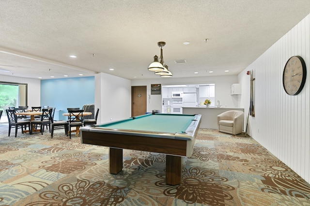 9600 Portland Ave S Unit 322, Bloomington, MN 55420 - recreation room with billiards table, a textured ceiling, recessed lighting, and light carpet