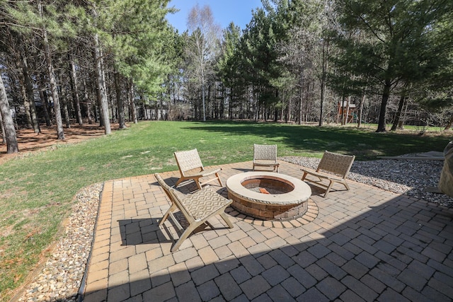 view of patio featuring a fire pit