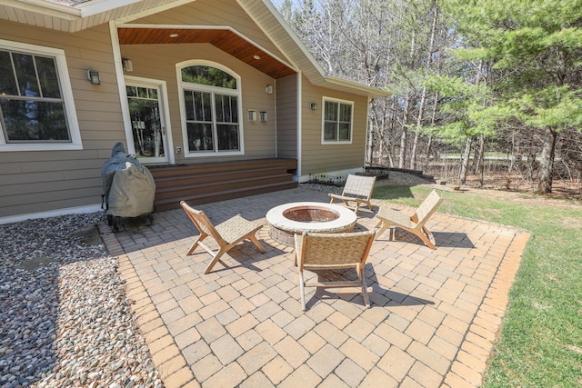 view of patio featuring an outdoor fire pit