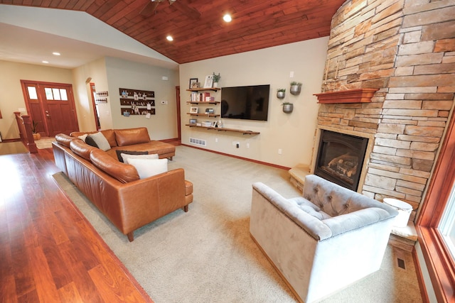 living area featuring visible vents, vaulted ceiling, wood finished floors, wooden ceiling, and baseboards