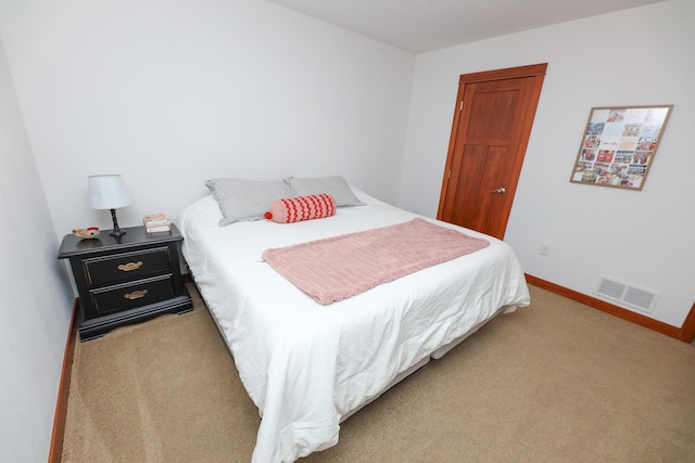 bedroom featuring visible vents, baseboards, and carpet floors