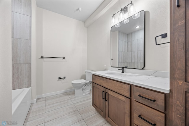 bathroom with tile patterned floors, baseboards, vanity, and toilet