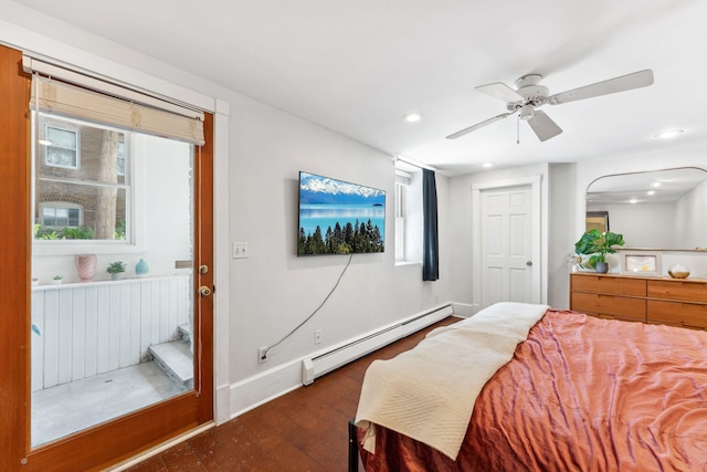 bedroom featuring baseboards, a baseboard radiator, wood finished floors, and recessed lighting