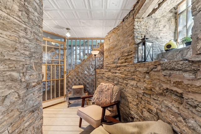 interior space featuring an ornate ceiling and hardwood / wood-style flooring