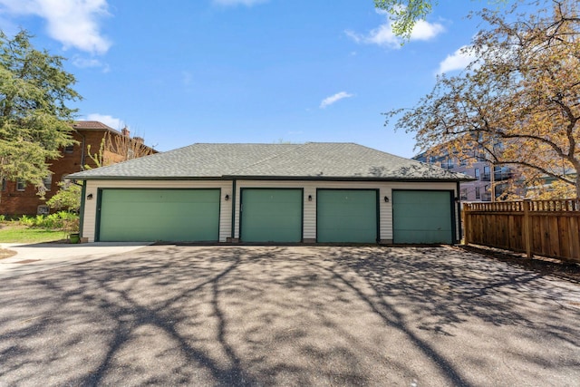 garage featuring fence