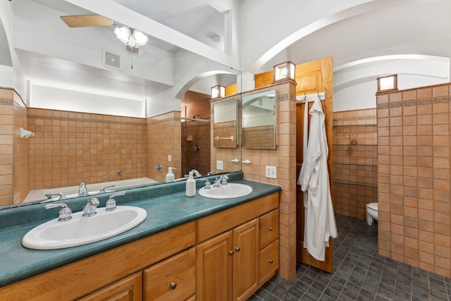 710 Summit Ave Unit 4, Saint Paul, MN 55105 - full bathroom featuring tile walls, tile patterned floors, a bath, double vanity, and a shower