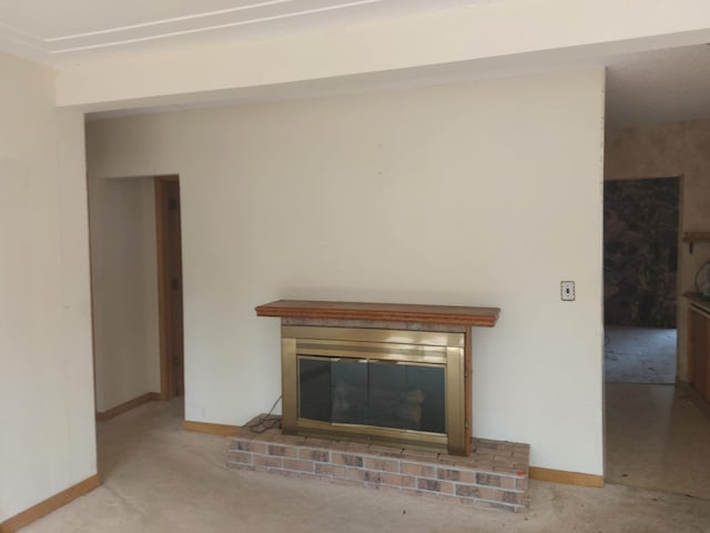 room details featuring baseboards, carpet flooring, and a fireplace