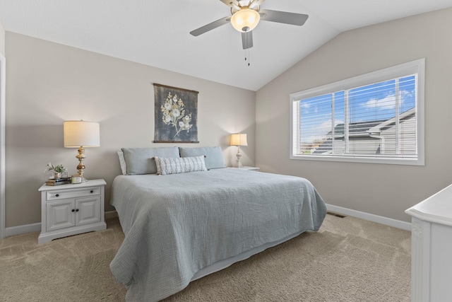 bedroom featuring baseboards, light carpet, and lofted ceiling