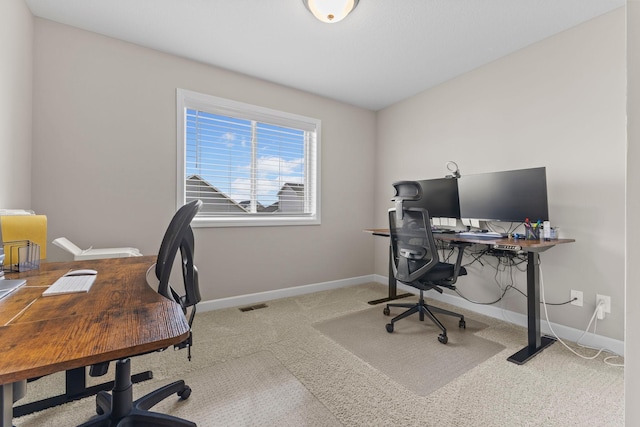 office area with carpet floors, baseboards, and visible vents